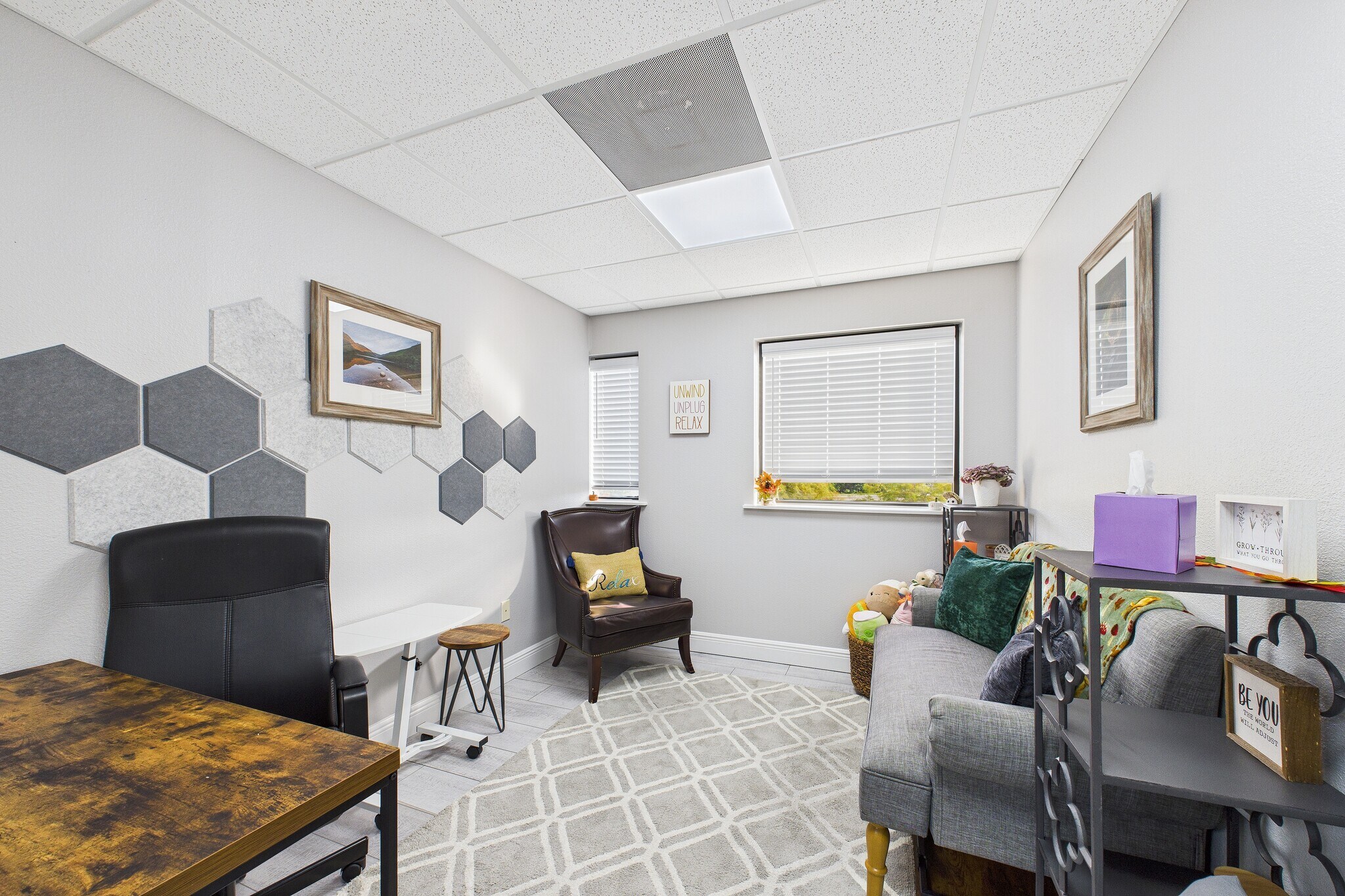 Play therapy room with child seating and whiteboard