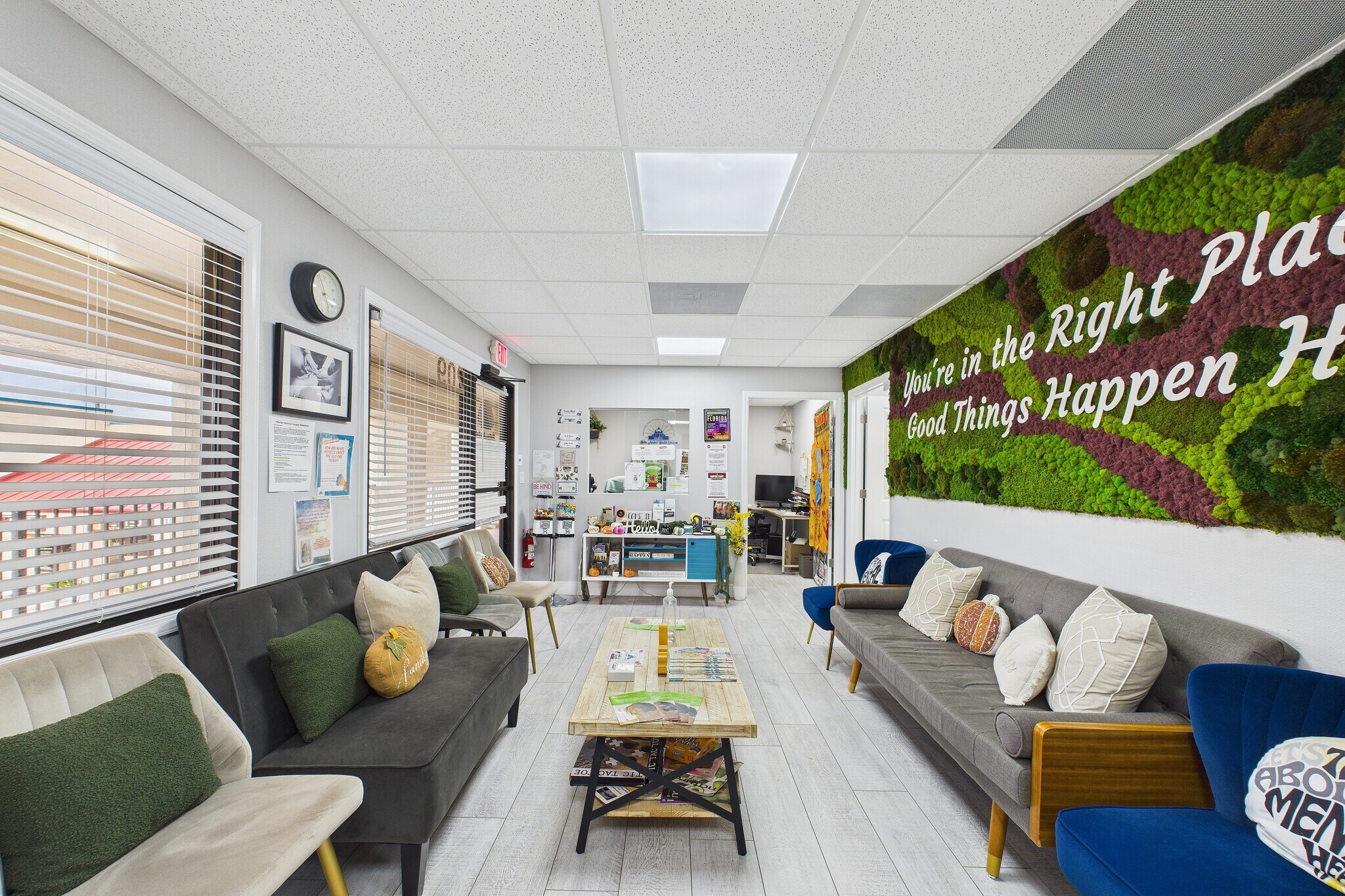 Reception and waiting area with moss wall at Bella Mental Health Therasuites in Melbourne, FL